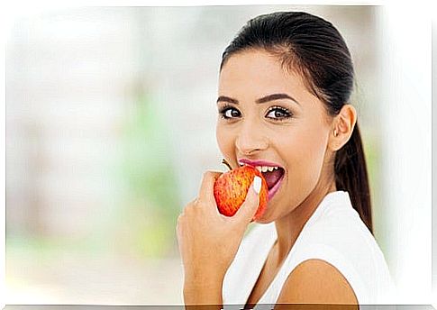 Woman eating fruit