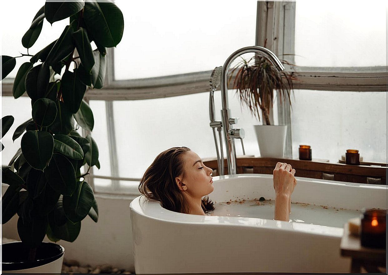 Woman taking a hot bath to relax.