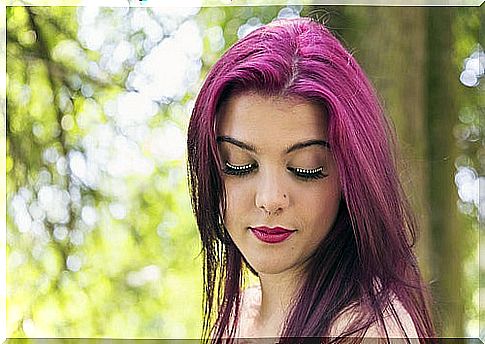 Woman with dyed maroon hair