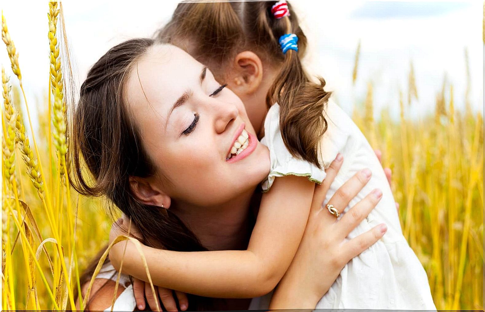 mother-hugging-her-daughter representing good children