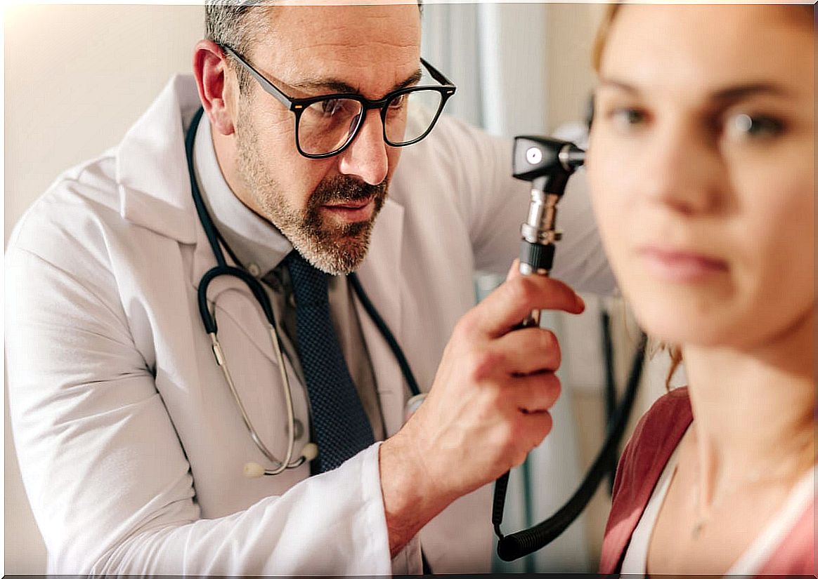 Doctor checks cauliflower ear.