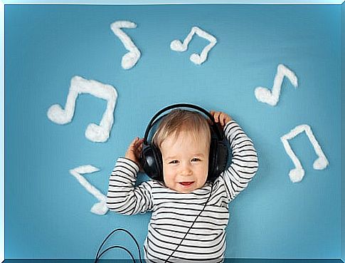 Baby with headphones surrounded by music notes.