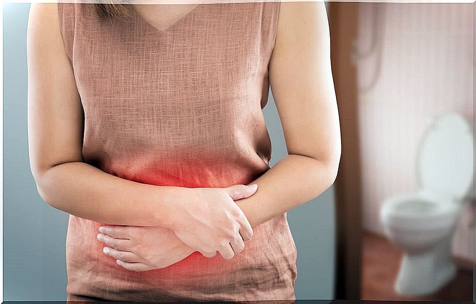 Woman with pain in the abdomen and toilet in the background